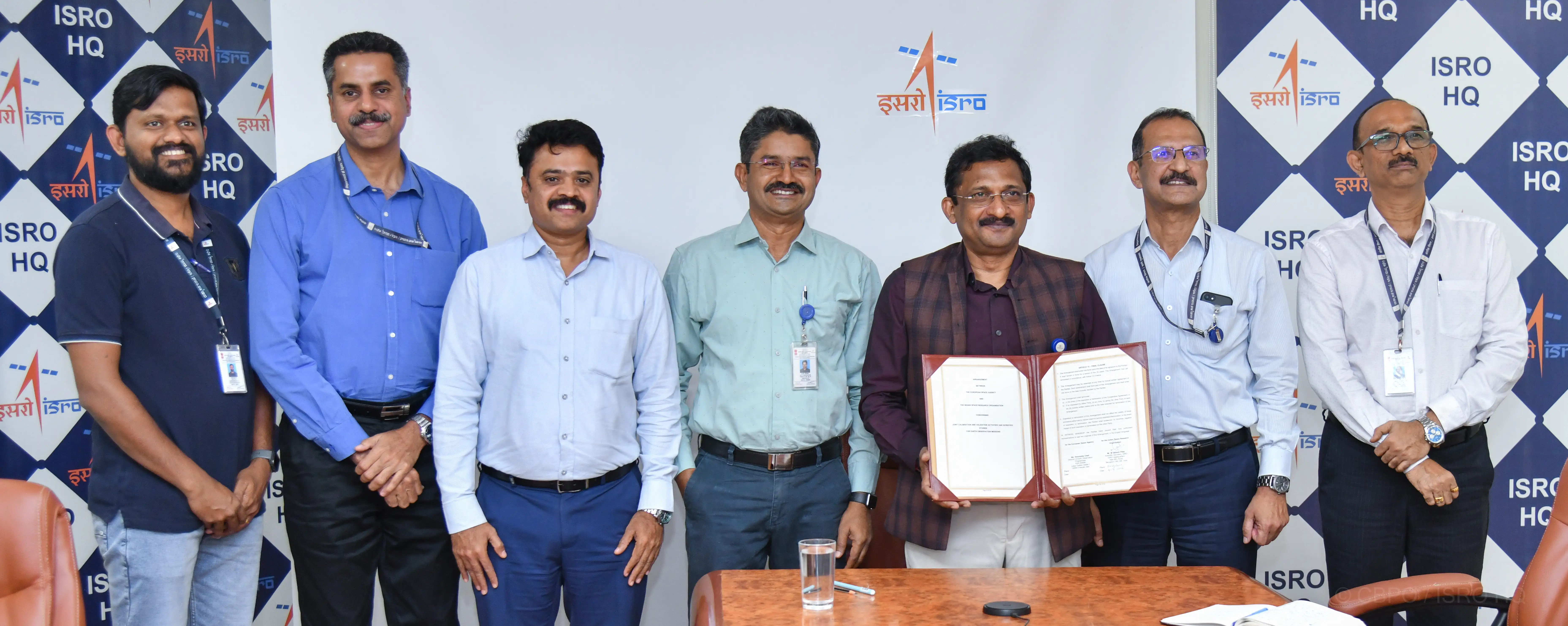 Scientific Secretary signing the agreement and ISRO team realising the instrument
                                        