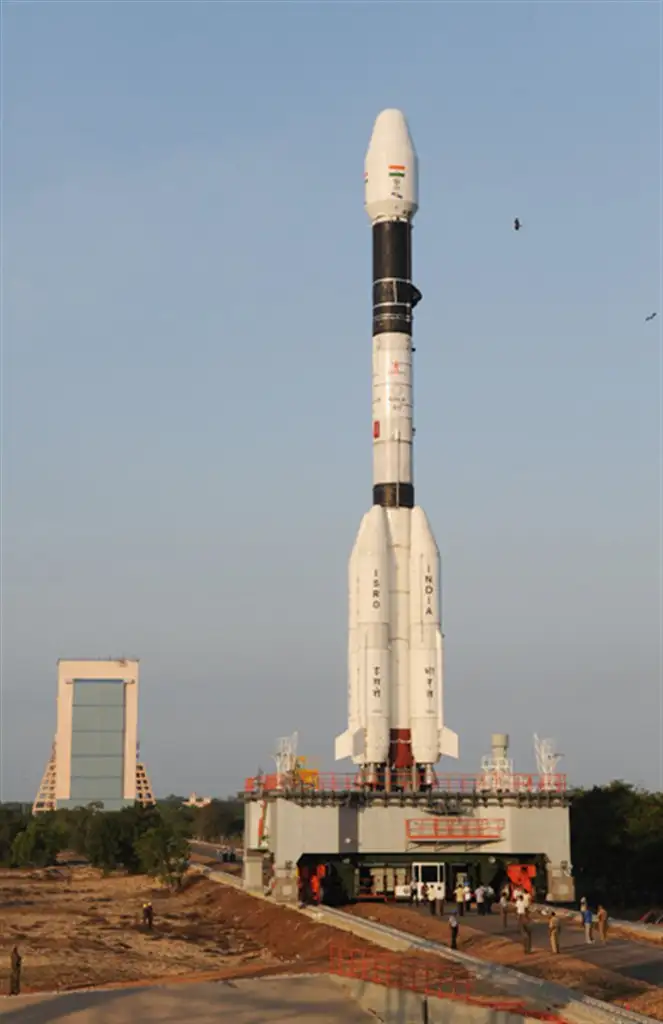 GSLV-D3 being transported to second launch pad with the vehicle assembly building in the background