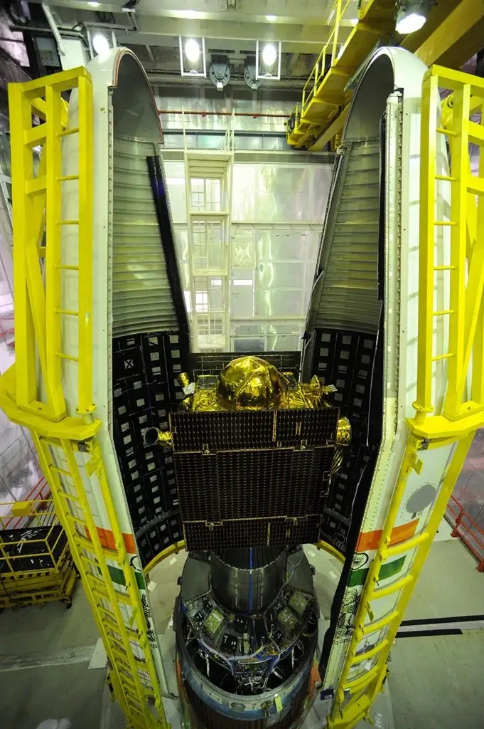 IRNSS-1D between two halves of PSLV-C27 heat shield