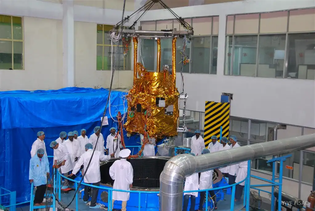 Spacecraft is being loaded into thermal vacuum chamber for environmental qualification test